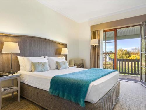 Postel nebo postele na pokoji v ubytování Peppers Manor House