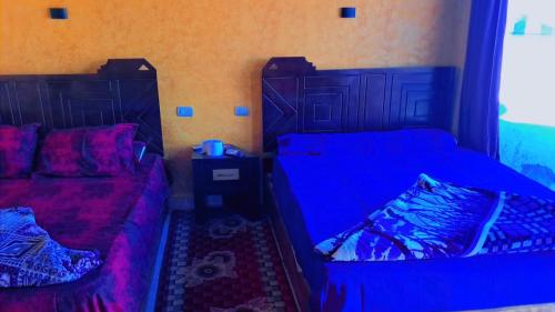 Voodi või voodid majutusasutuse Qamar Sinai toas