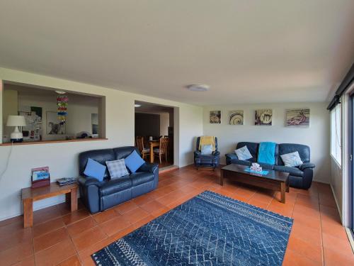 a living room with two couches and a rug at Relax in San Remo Pets Welcome in San Remo