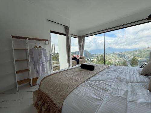 Ένα ή περισσότερα κρεβάτια σε δωμάτιο στο Pinggan Mountain View Batur