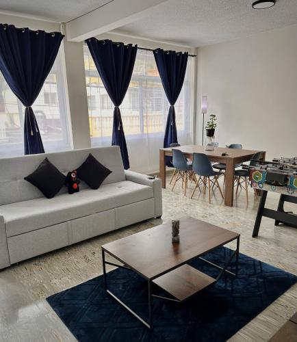 a living room with a couch and a table at DCalli Next to the Alameda, terrace and confort in Orizaba