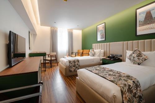 Ένα ή περισσότερα κρεβάτια σε δωμάτιο στο MK Colombo