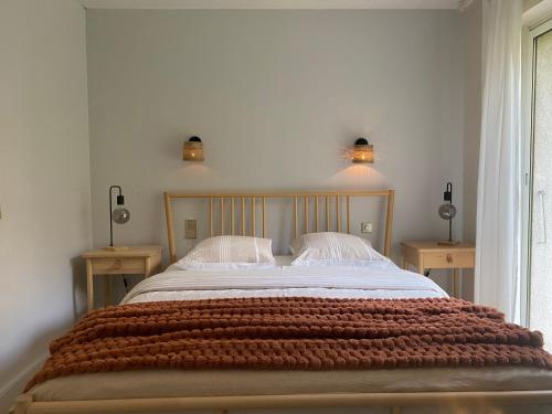 Postel nebo postele na pokoji v ubytování logement avec accès piscine