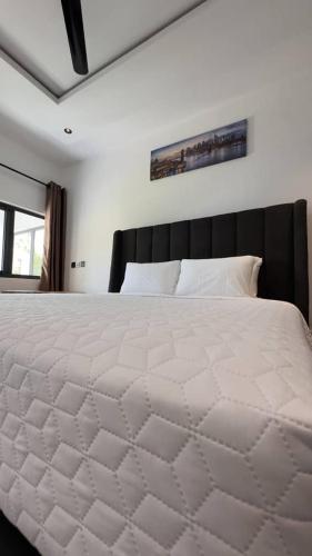 Ένα ή περισσότερα κρεβάτια σε δωμάτιο στο Newport Hotel