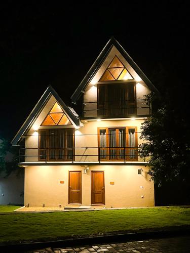 a lit up house at night with lights at Riverston Grand Villas in Meda-Ela