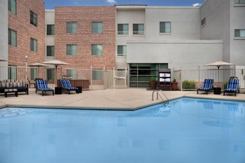 a swimming pool in front of a building at Hampton Inn & Suites Denver Tech Center in Centennial