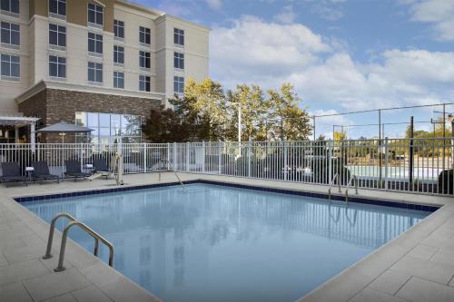 a swimming pool in front of a building at Homewood Suites by Hilton Concord in Concord
