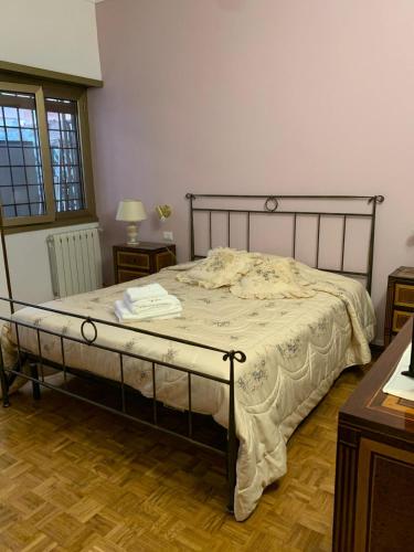 Ένα ή περισσότερα κρεβάτια σε δωμάτιο στο Vatican Lodge