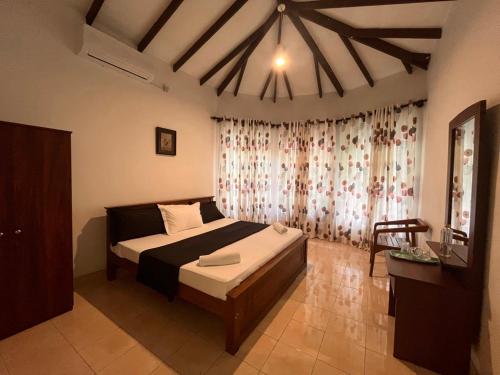Ένα ή περισσότερα κρεβάτια σε δωμάτιο στο Greenbell villa