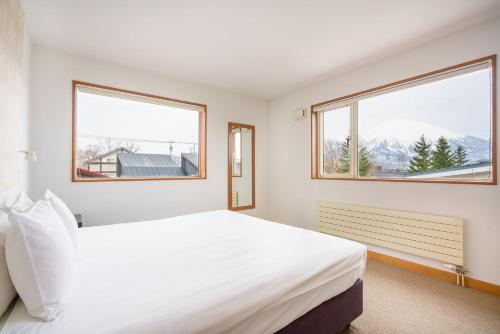 Ένα ή περισσότερα κρεβάτια σε δωμάτιο στο Itoku