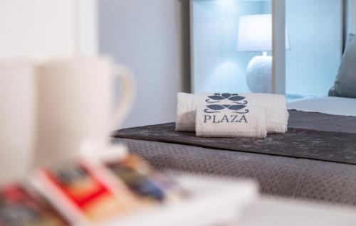a hotel room with a pile of toilet paper on a bed at B&B PLAZA in Lampedusa
