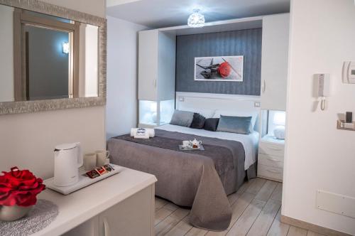 a bedroom with a bed in a room at B&B PLAZA in Lampedusa