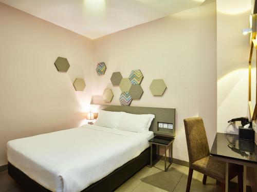 Postel nebo postele na pokoji v ubytování ibis budget Singapore Imperial