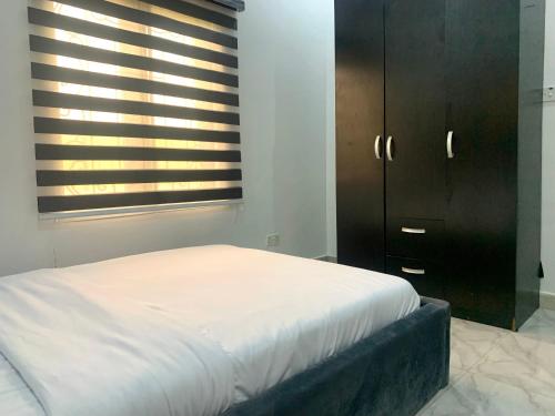 Postel nebo postele na pokoji v ubytování Comfy Abode