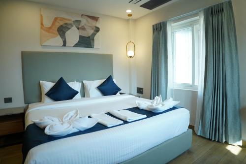 En eller flere senge i et værelse på Trunk and Trolley, Gachibowli, A Luxury Boutique Hotel, Hyderabad