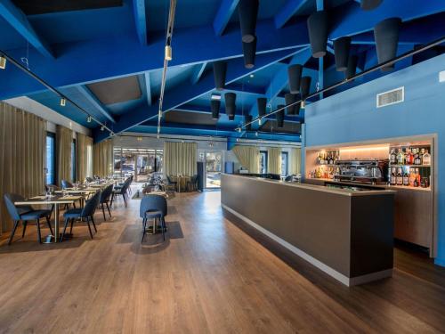 Restoran või mõni muu söögikoht majutusasutuses Mercure Toulouse Aeroport Blagnac