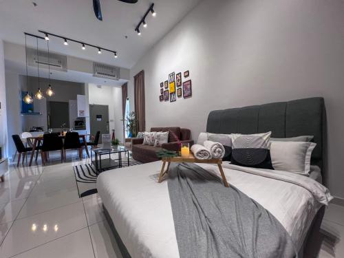 a bedroom with a bed and a living room at Georgetown#Beacon Executive Suite SkyPool#Luxury&Glamorous Suite#2BR#Living Room with Queen Bed in George Town
