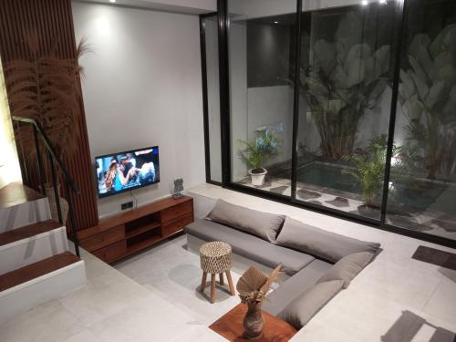 Μια τηλεόραση ή/και κέντρο ψυχαγωγίας στο Private Villa In Sanur Harbour