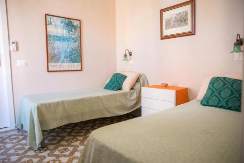 Ένα ή περισσότερα κρεβάτια σε δωμάτιο στο La casa di Venere