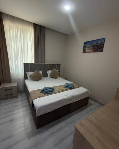 a bedroom with a large bed in a room at Samanid hotel in Salor Bekati