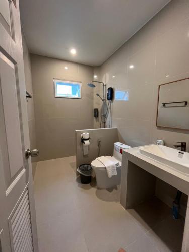 a bathroom with a toilet and a sink at khaolakcamping in Ban Lam Ru (1)