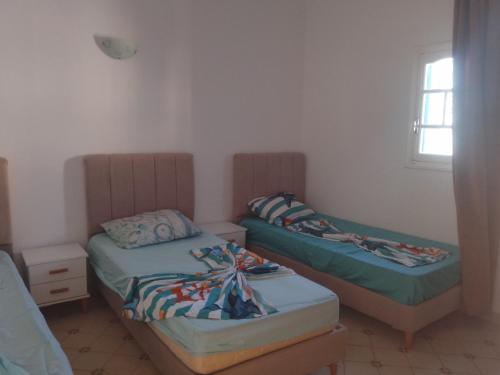 Postel nebo postele na pokoji v ubytování taguermess 2