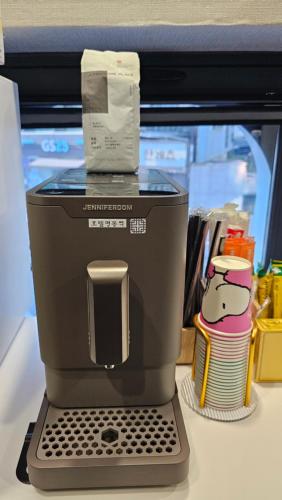 a coffee maker sitting on top of a counter at Hotel Myeongdon Station in Seoul