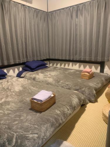 Postel nebo postele na pokoji v ubytování 仁信小屋