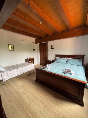 Ένα ή περισσότερα κρεβάτια σε δωμάτιο στο Agriturismo Verde Friuli