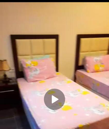 a bedroom with two beds with a number on it at Escape to Heaven in Sharm El Sheikh
