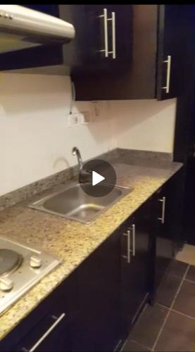 a kitchen with a sink and a counter top at Escape to Heaven in Sharm El Sheikh