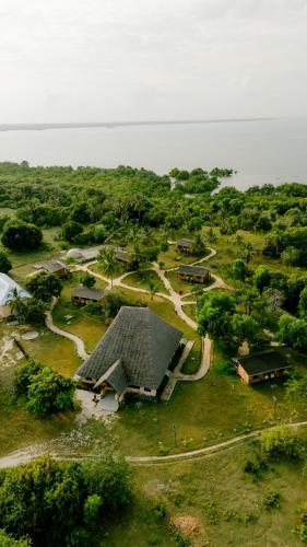 an aerial view of a house in a field at Signature Collections by Eight Continents in Utende