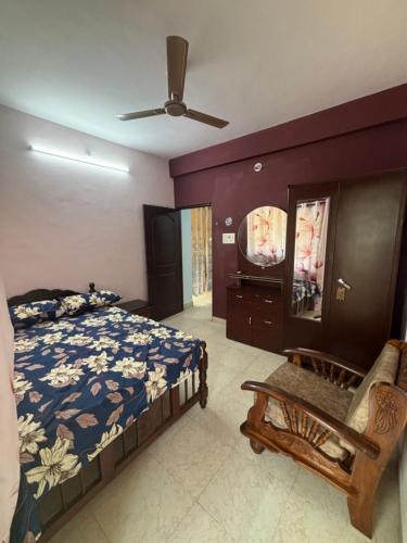 a bedroom with a bed and a tv in it at Casa de Aaron in Colva