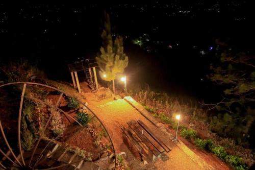 a group of benches in a park at night at Skyhill Kandy in Hindagala