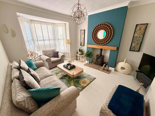 a living room with a couch and a table at Cathedral Quarter House with free Secure Driveway Parking for 2 Cars in Lincoln