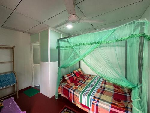 Cama o camas de una habitación en Uvindu Villa - Cozy By Midigama