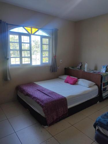 Postel nebo postele na pokoji v ubytování Casa Sossêgo