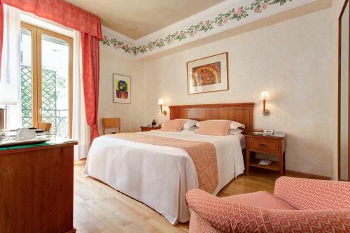 Postel nebo postele na pokoji v ubytování Hotel Firenze