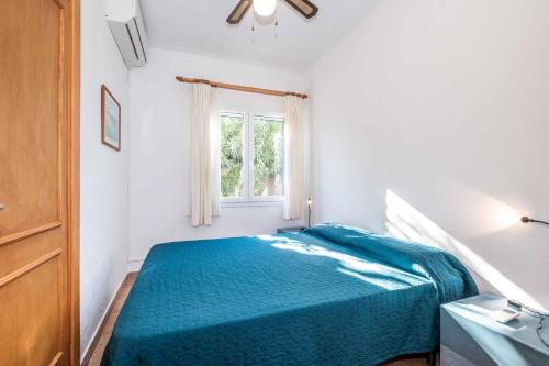 En eller flere senge i et værelse på Villa Catieta