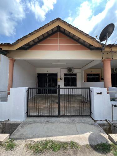 a house with a gate in front of it at 7 STAY#3 - 1 Room for 2 Pax at Kuala Berang -Best Travelers Stay in Kuala Berang