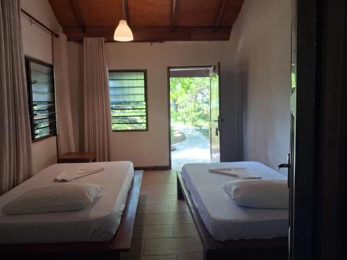 Ένα ή περισσότερα κρεβάτια σε δωμάτιο στο Ko-Sa Beach Resort Ltd