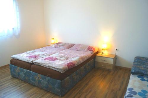 Postel nebo postele na pokoji v ubytování Apartments Grebenec