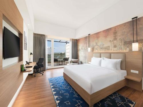 Voodi või voodid majutusasutuse Mercure Lucknow Gomti Nagar toas