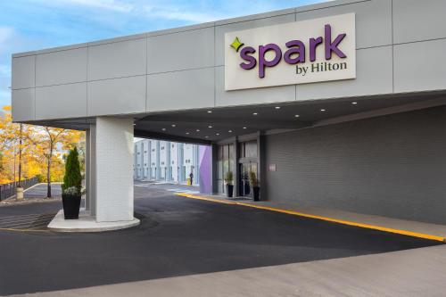 a spark by hilton building with a sign on it at Spark by Hilton Toronto Airport in Toronto
