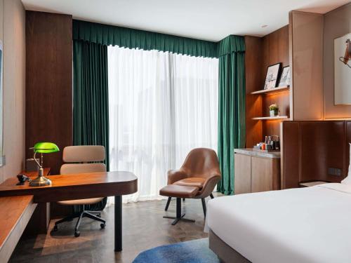 Ένα ή περισσότερα κρεβάτια σε δωμάτιο στο Novotel Shanghai Baoshan Jiusi