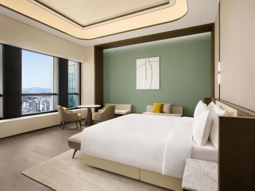 Voodi või voodid majutusasutuse Pullman Ambassador Seoul Eastpole toas