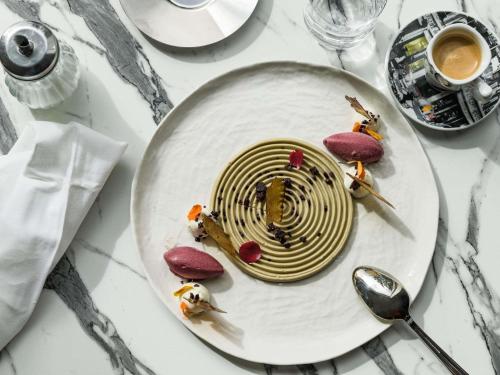 a plate of food on top of a table at Mercure Chartres Est in Chartres