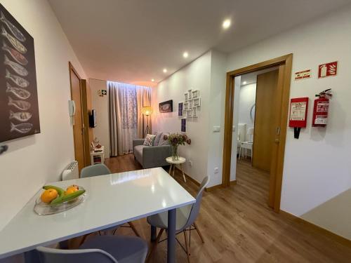 a living room with a white table and chairs at Povoa do Mar in Póvoa de Varzim