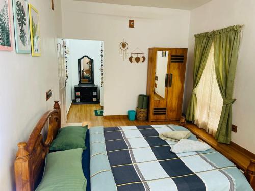 a bedroom with a large bed in a room at Raaga on the Beach in Kannur