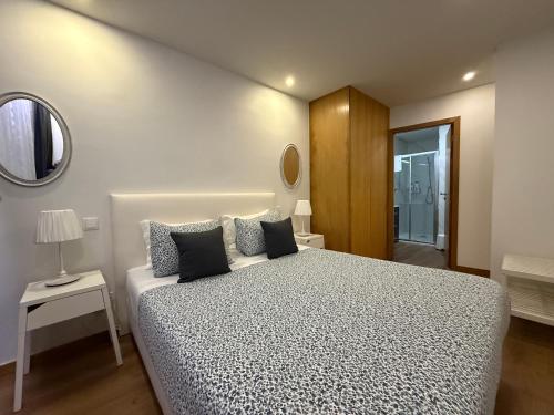 Postel nebo postele na pokoji v ubytování Povoa do Mar